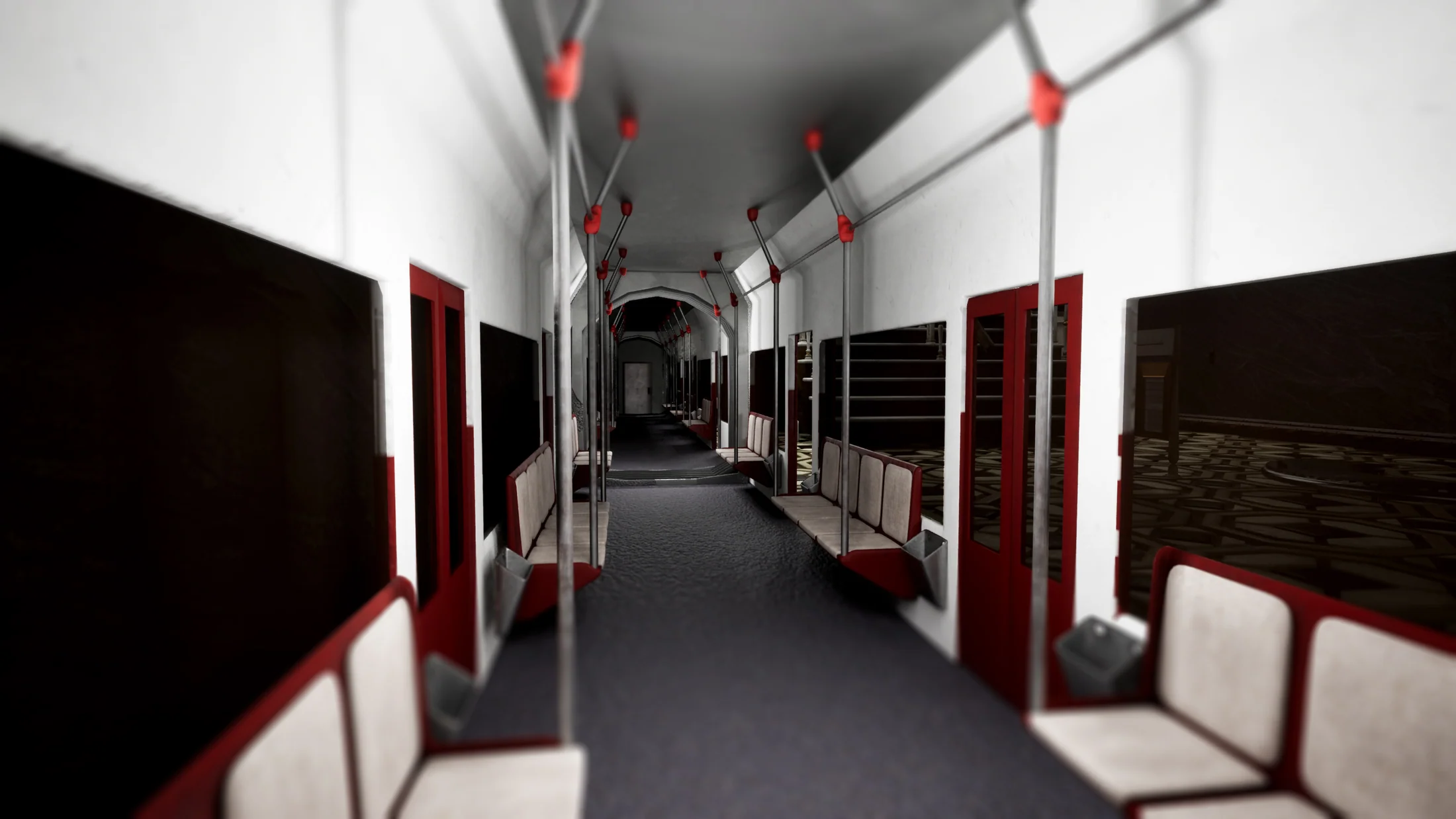 Interior de un vagon de la estacion de metro, con asientos rojos y crema, barras metalicas y suelo con motivos geometricos